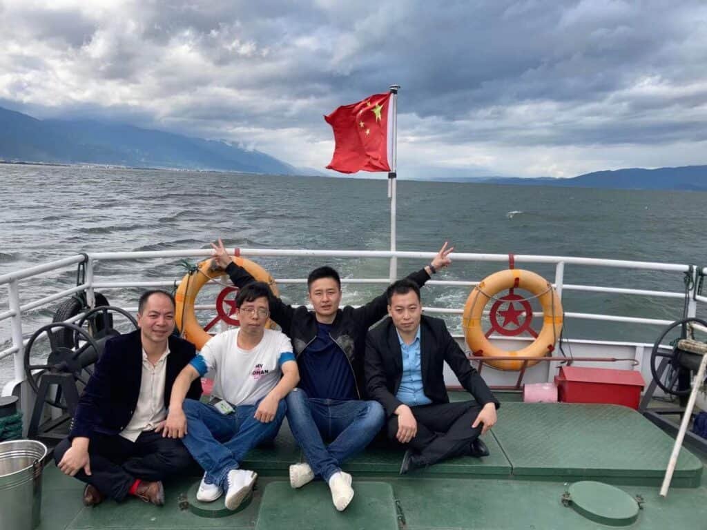 team travelling in Erhai of Dali in Yunnan province